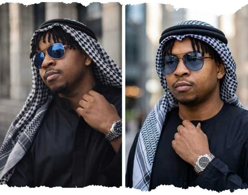 Ultra-realistic cinematic portrait of a man in traditional Arabian attire with keffiyeh, sunglasses, and luxury watch, generated using an AI image prompt by Victor Ijomah